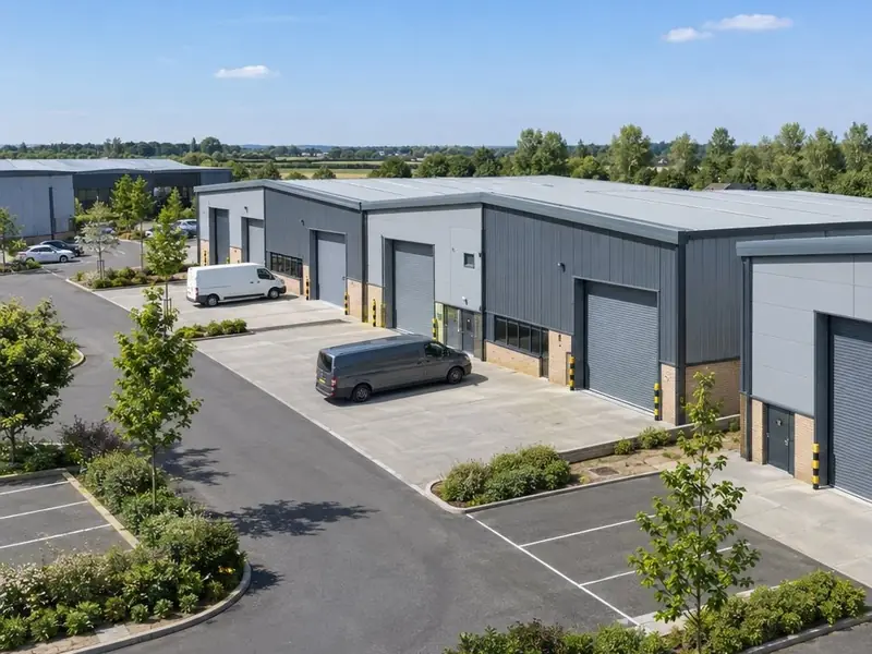 Industrial units on a business park with grey roller shutter doors